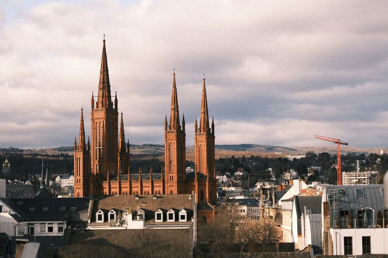 The red towers of the Marktkirche above the rooftops of Wiesbaden