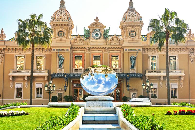 Facade of the Casino de Monte-Carlo with a mirrored sphere sculpture in front