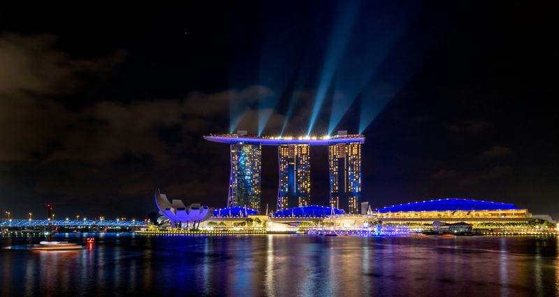 Marina Bay in Singapore at blue hour with garden domes and skyline